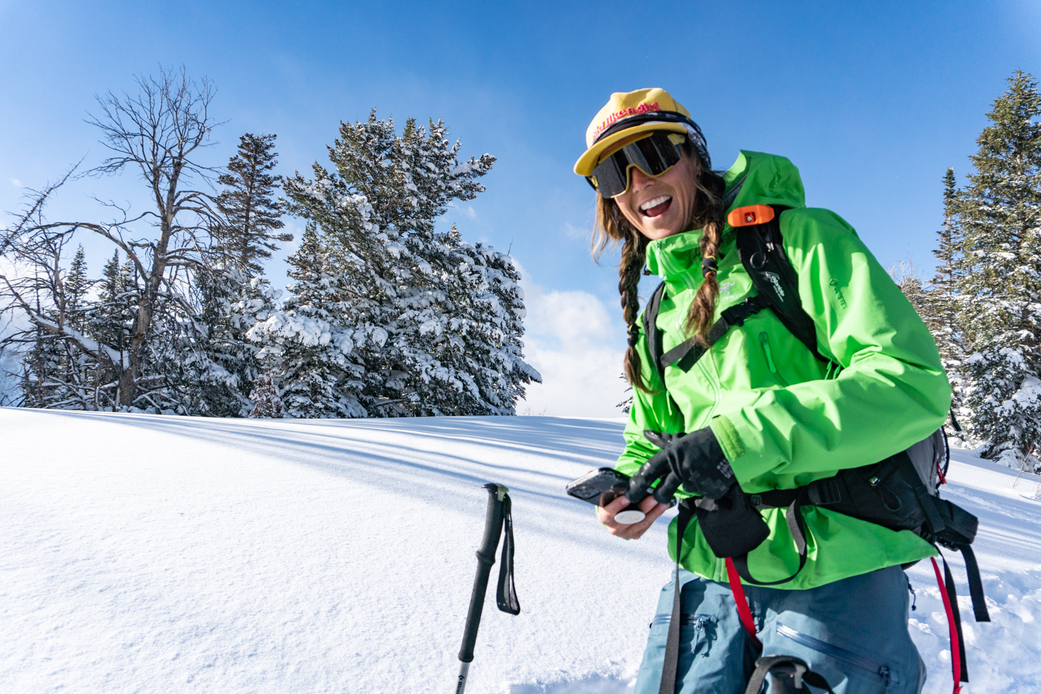 woman backcountry skiing smiling wasatch utah