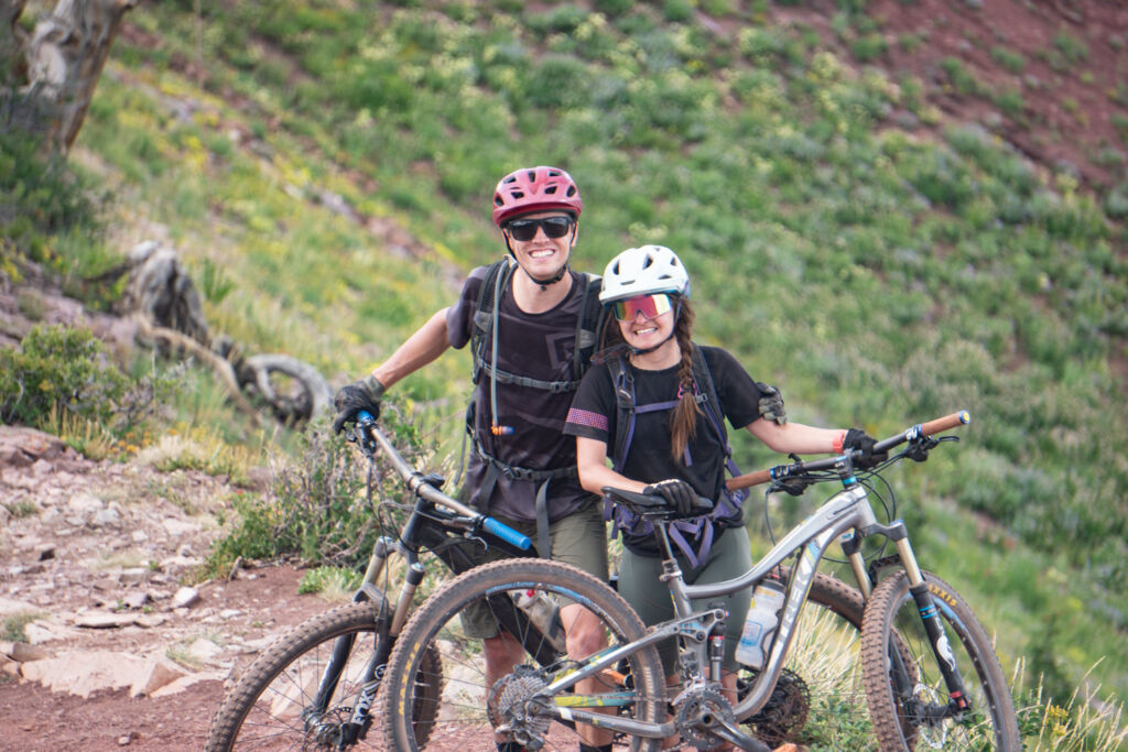 couple mountain biking
